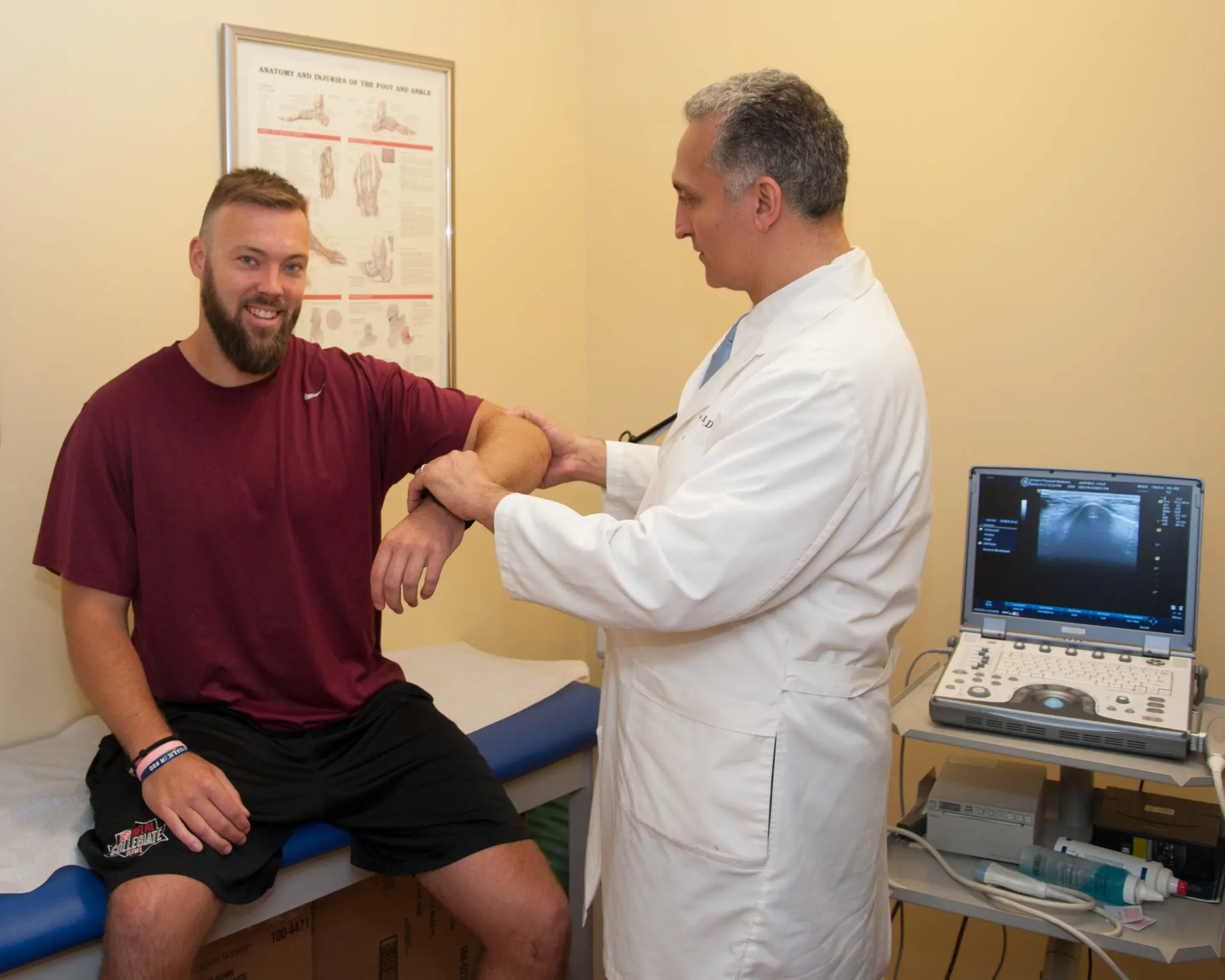 doctor examines elbow