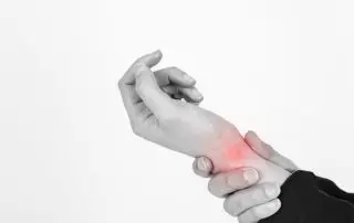 The carpal tunnel is a narrow passageway surrounded by bones and ligaments on the palm side of your hand. When the median nerve is compressed, the symptoms can include numbness, tingling and weakness in the hand and arm.